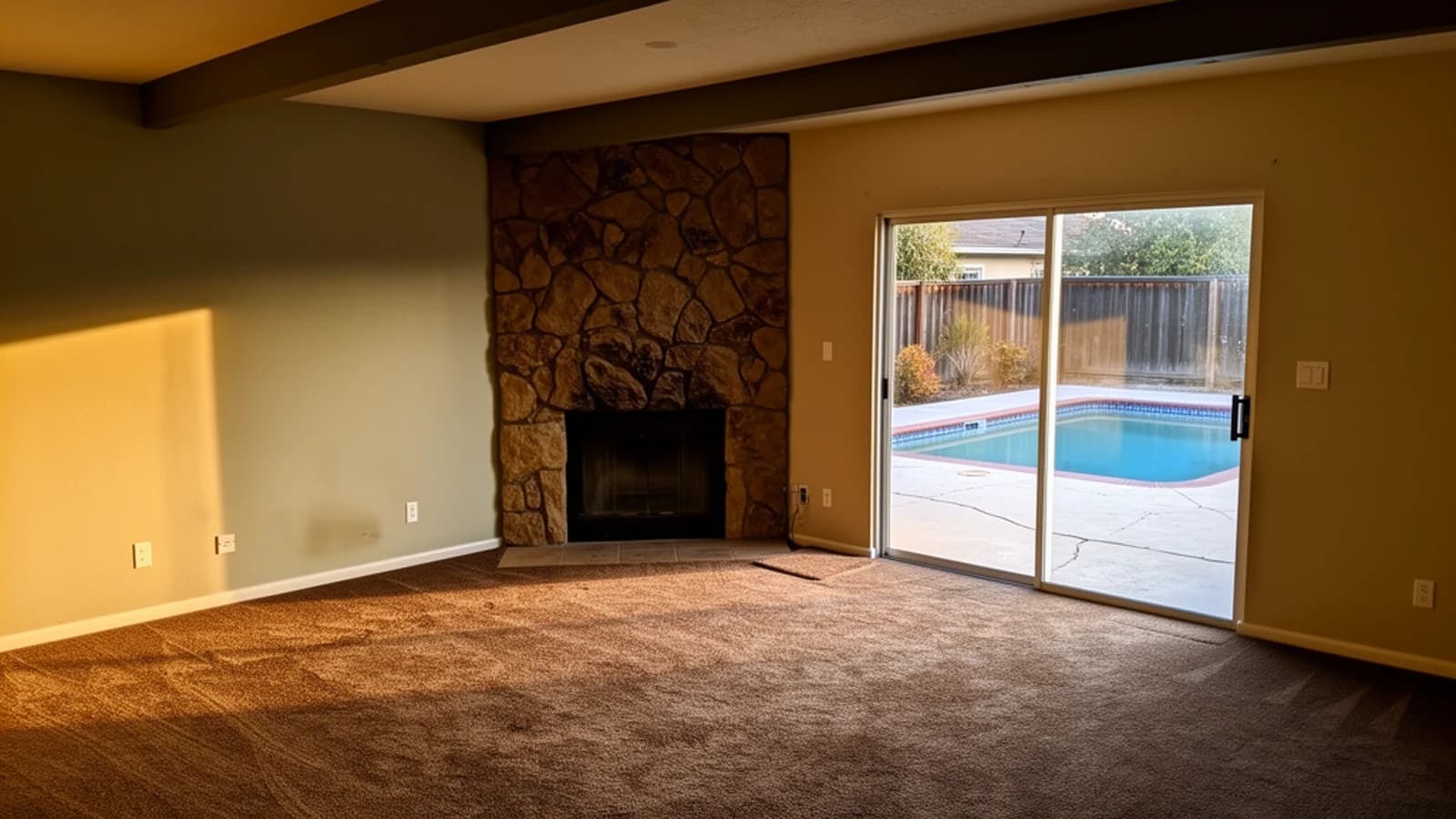 Existing living room concept viewed from a rear corner toward a closed pool patio